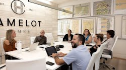 Camelot Homes team meets in a conference room Camelot Homes team meets in a conference room