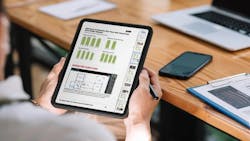 An individual looks over the buyer conversion report on a tablet An individual looks over the buyer conversion report on a tablet