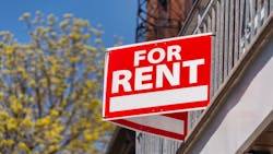 A red sign that reads 'For Rent' posted on a balcony A red sign that reads 'For Rent' posted on a balcony