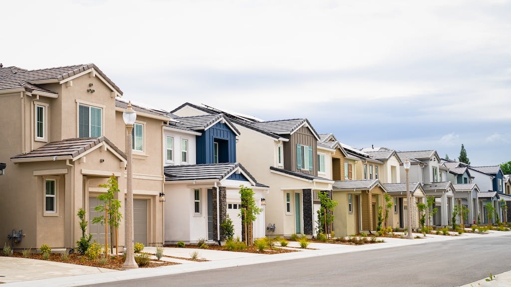 A row of single-family homes on a suburban street