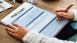 A homebuyer fills out an FHA loan application A homebuyer fills out an FHA loan application