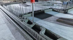 A 3D printer working on creating the walls of a home