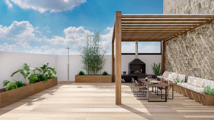 Outdoor lounge area with fireplace, dining table, and plantings