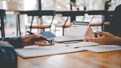 A prospective homebuyer fills out a mortgage loan application A prospective homebuyer fills out a mortgage loan application