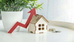 A model home with a red arrow pointing upward, indicating rising costs for homeownership A model home with a red arrow pointing upward, indicating rising costs for homeownership