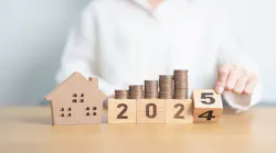 Stacks of coins sit on top of blocks that spell '2025,' indicating rising prices in the new year