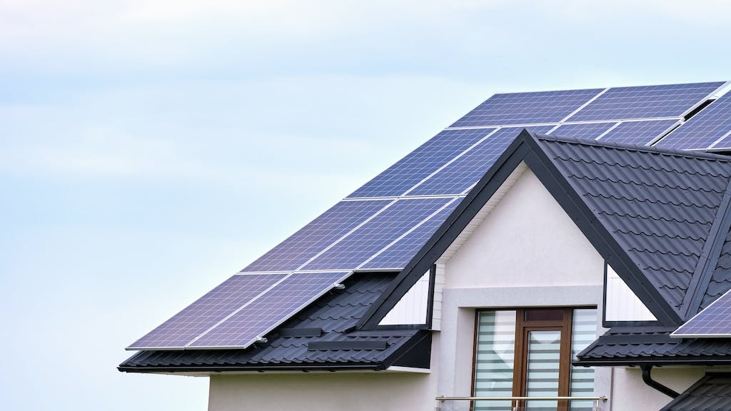 Solar panels on the roof of a home on a sunny day