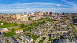 Aerial view of residential neighborhood in Detroit with city skyline in the background Aerial view of residential neighborhood in Detroit with city skyline in the background