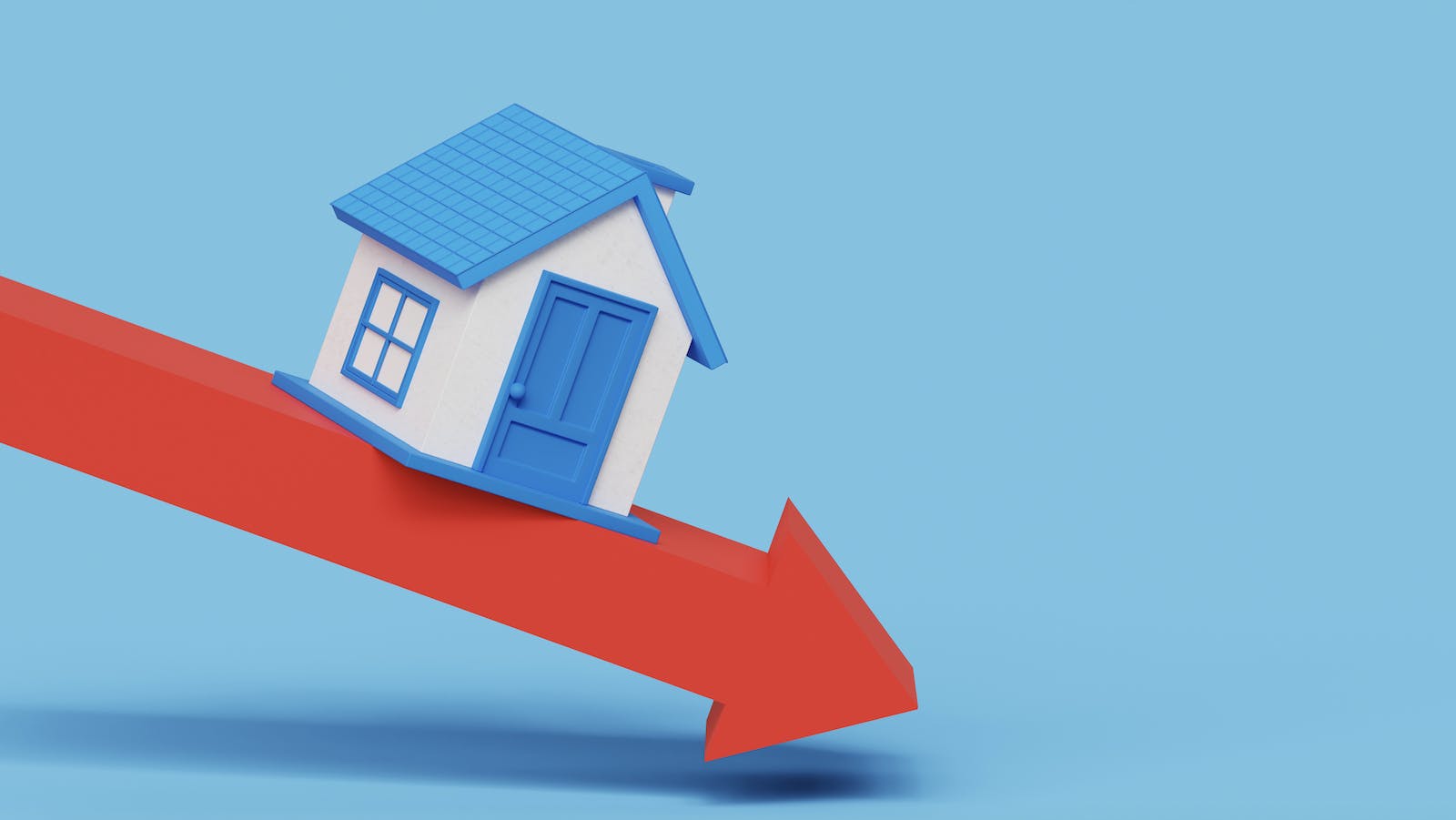 Home sales downward trend shows model of house on down-facing red arrow