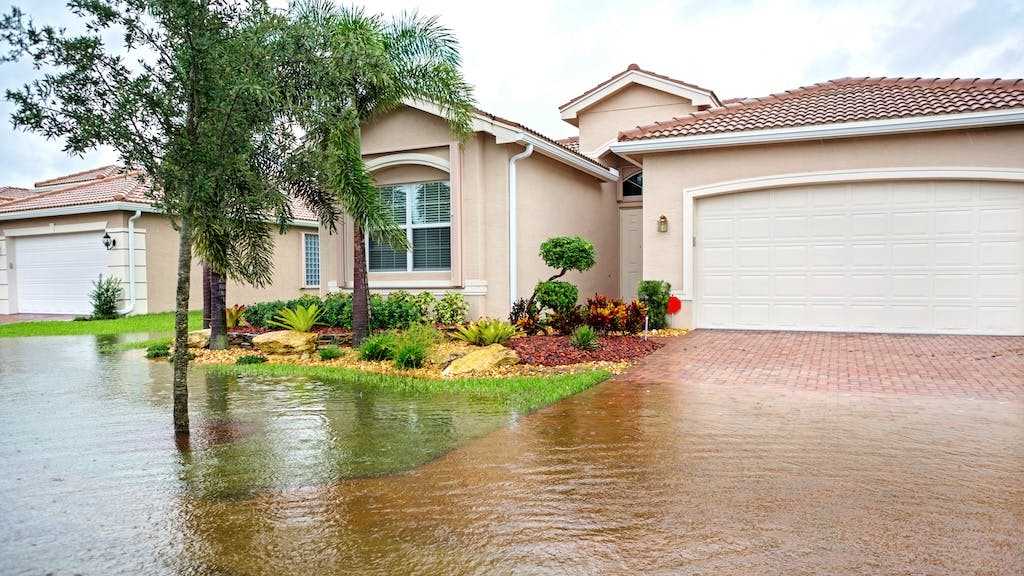A home in Florida with the front yard flooded following a hurricane