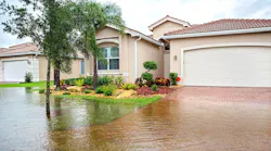 A home in Florida with the front yard flooded following a hurricane