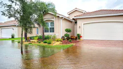A home in Florida with the front yard flooded following a hurricane