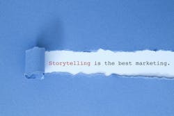 Blue paper strip torn back to reveal words saying: 'Storytelling is the best marketing' Blue paper strip torn back to reveal words saying: 'Storytelling is the best marketing'
