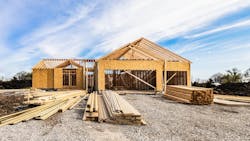 A single-family home at the framing stage of construction A single-family home at the framing stage of construction