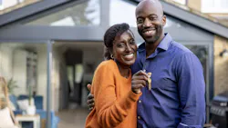 Black homebuyer couple hold keys to their new home Black homebuyer couple hold keys to their new home