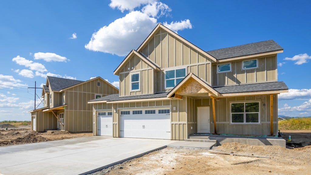 View from the street of a finished but unsold newly constructed single-family home
