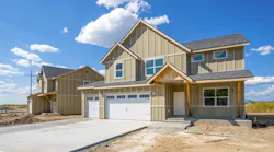 View from the street of a finished but unsold newly constructed single-family home
