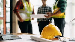 A construction crew looks over plans for a home to ensure they anticipate as many hurdles as possible for a successful project outcome. A construction crew looks over plans for a home to ensure they anticipate as many hurdles as possible for a successful project outcome.