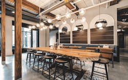 Interior at Chronicle Mill, with bar seating and a dining area Interior at Chronicle Mill, with bar seating and a dining area