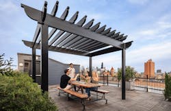 Outdoor living on the rooftop deck of the Peabody School Apartments, a 2023 BALA winner Outdoor living on the rooftop deck of the Peabody School Apartments, a 2023 BALA winner