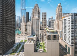 View of the renovated Chicago Tribune building with the Chicago skyline in the background View of the renovated Chicago Tribune building with the Chicago skyline in the background