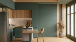 A modern green kitchen with wooden accents