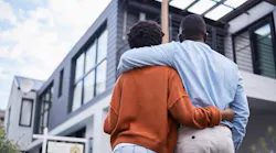 A Black couple looks at their newly purchased home