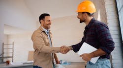 Construction worker shakes hands with a potential employer as the number of new construction job openings declines. Construction worker shakes hands with a potential employer as the number of new construction job openings declines.
