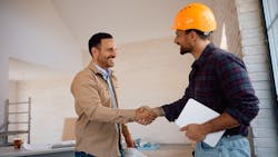 Construction worker shakes hands with a potential employer as the number of new construction job openings declines. Construction worker shakes hands with a potential employer as the number of new construction job openings declines.