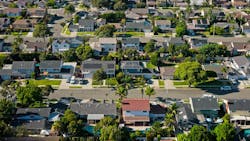 Aerial view of single-family suburban homes. Aerial view of single-family suburban homes.