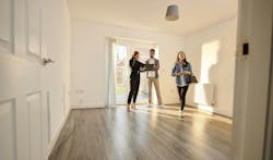 Young homebuyers touring a home with a real estate agent as homeownership rates among younger generations stagnate. Young homebuyers touring a home with a real estate agent as homeownership rates among younger generations stagnate.