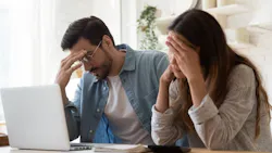A couple looks stressed as they look over their finances and realize homeownership isn't possible. A couple looks stressed as they look over their finances and realize homeownership isn't possible.
