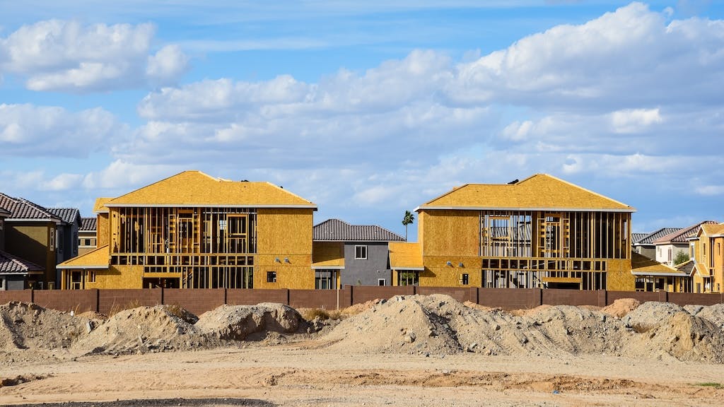 Single-family homes under construction at a time when the volume of residential construction loans is declining.