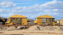 Single-family homes under construction at a time when the volume of residential construction loans is declining.