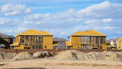 Single-family homes under construction at a time when the volume of residential construction loans is declining. Single-family homes under construction at a time when the volume of residential construction loans is declining.