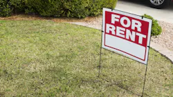 A 'For Rent' sign in a front yard as rent prices increase slightly.