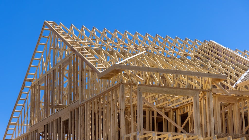 Single-family home under construction as residential construction spending grows.