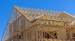 Single-family home under construction as residential construction spending grows.