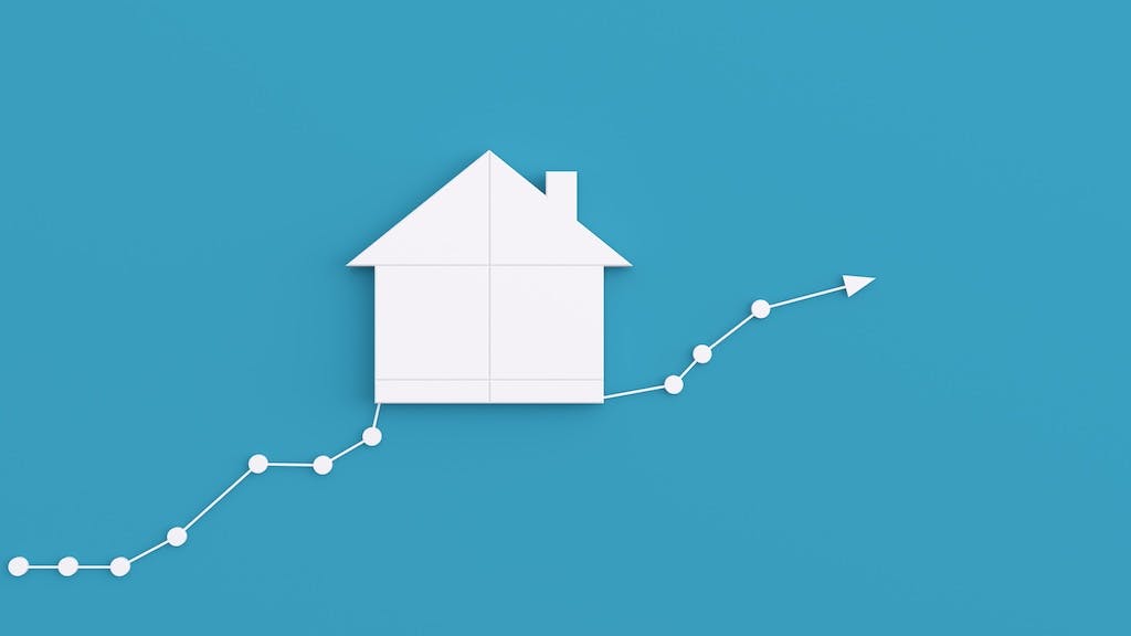 Home with chart and arrow showing an increase in prices