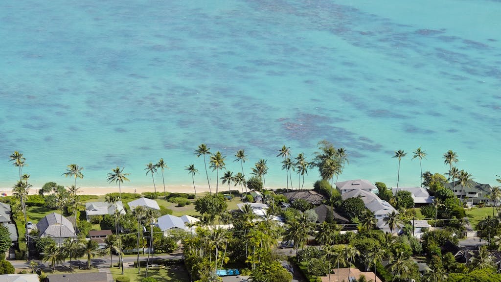 Homes near a beach in Hawaii, a state where housing costs are extremely high.