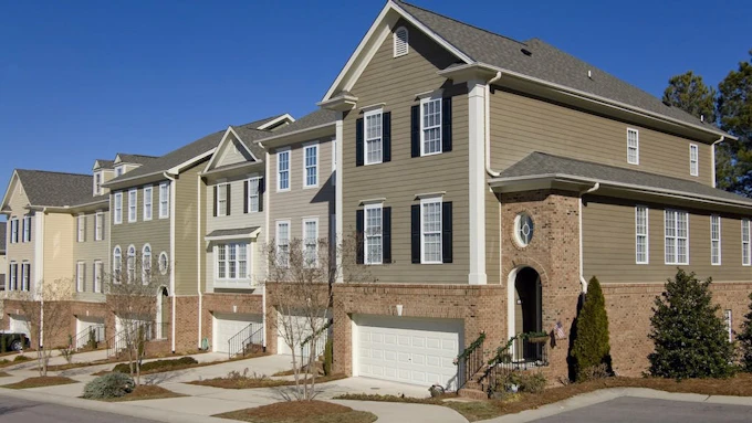 Row of townhomes on narrow lots.