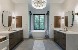 The soaking tub and vanities in Living Stone Design+Build's primary bathroom design. The soaking tub and vanities in Living Stone Design+Build's primary bathroom design.