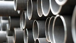 Closeup of stacked metal pipe as construction costs rise. Closeup of stacked metal pipe as construction costs rise.