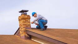 Home builder working on a roof as builders feel uncertain about economic prospects. Home builder working on a roof as builders feel uncertain about economic prospects.
