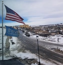 Note the damage from the December 2021 Marshall Fire in the foreground of this image and then on the far left you can see Thrive Home Builder's Downtown Superior project. None of the 30 homes in the project were lost. Photo courtesy of Thrive Home Builders. Note the damage from the December 2021 Marshall Fire in the foreground of this image and then on the far left you can see Thrive Home Builder's Downtown Superior project. None of the 30 homes in the project were lost. Photo courtesy of Thrive Home Builders.