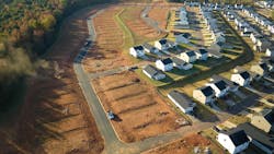 Housing development with cleared lots waiting for building indicate decrease in housing starts Housing development with cleared lots waiting for building indicate decrease in housing starts