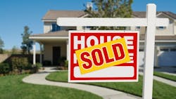 A 'sold' sign in the front yard of a home indicates that it has recently been sold. A 'sold' sign in the front yard of a home indicates that it has recently been sold.