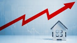 A model home with an arrow above it showing costs increasing A model home with an arrow above it showing costs increasing