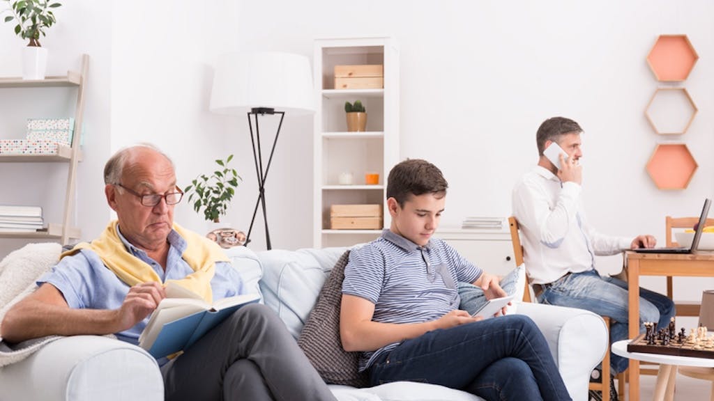 Multiple generations sitting in a living room together