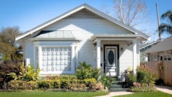 An older home that would have been considered a small starter home when it was first built. An older home that would have been considered a small starter home when it was first built.